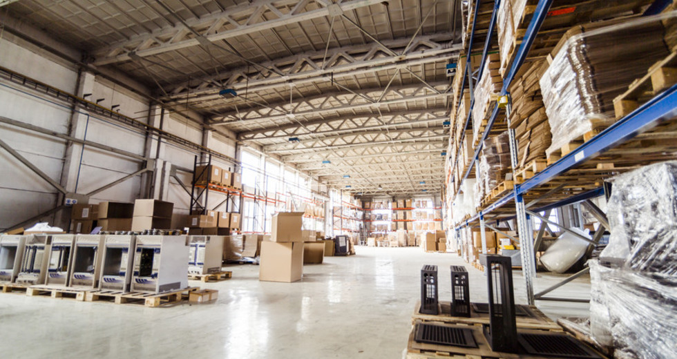 Pallets storing boxes in an industrial warehouse
